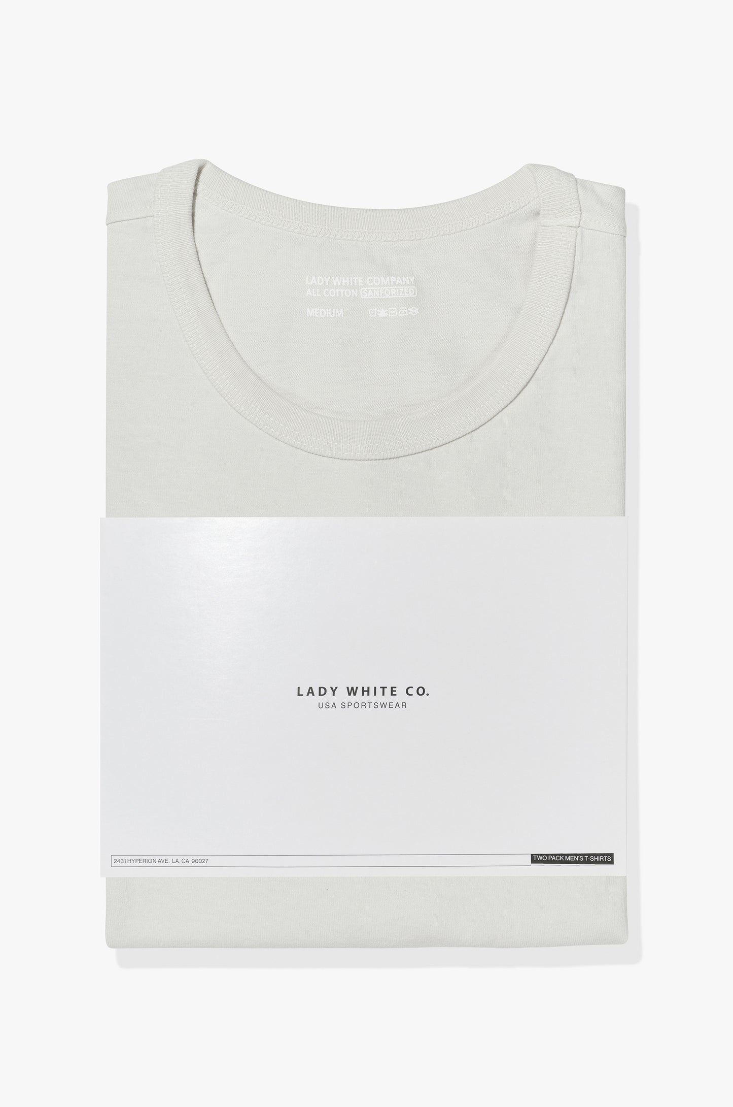 Two LW101 Our T-shirts stacked on top of each other, inside of a belly band
