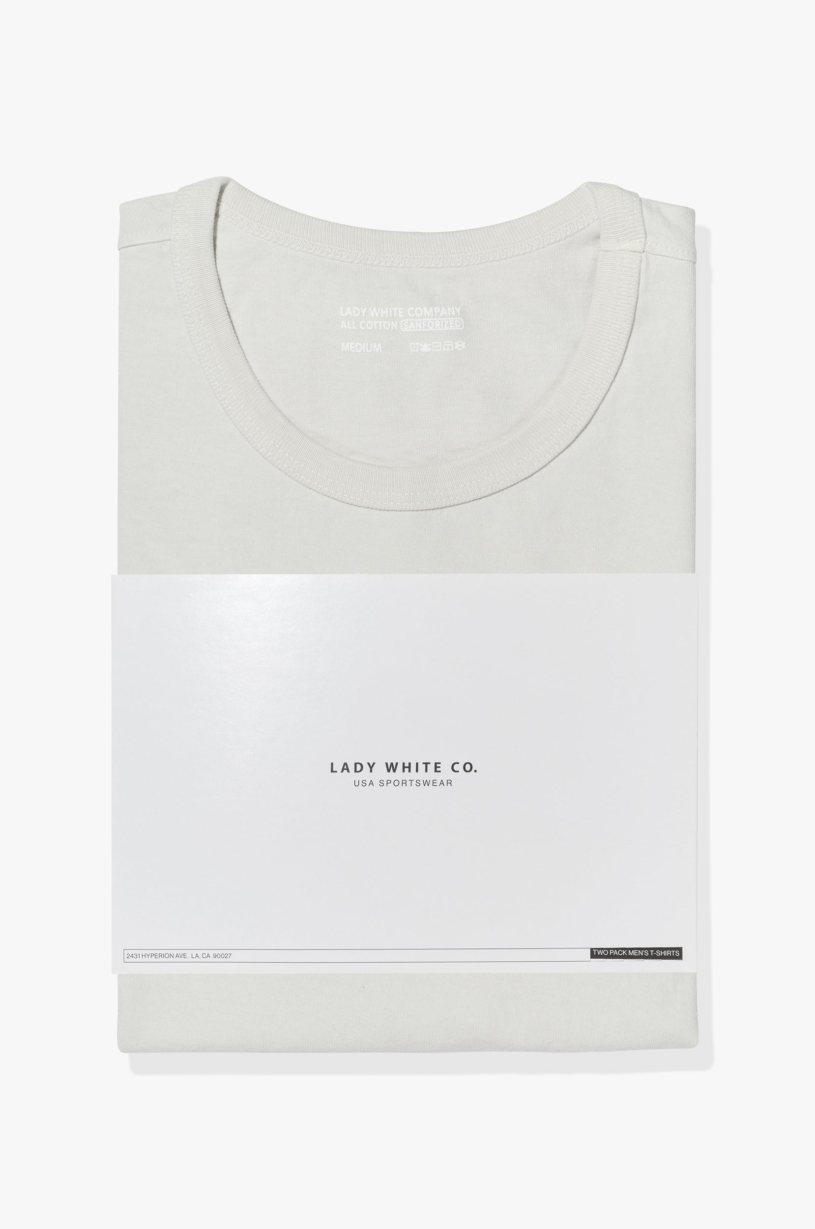 Two LW101 Our T-shirts stacked on top of each other, inside of a belly band